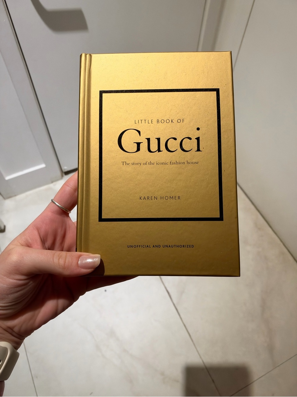 Gucci Gold Hardcover Little Book with Black Logo